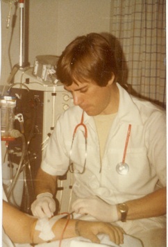 John McCormick as a nurse doing intravenous procedure on a patient