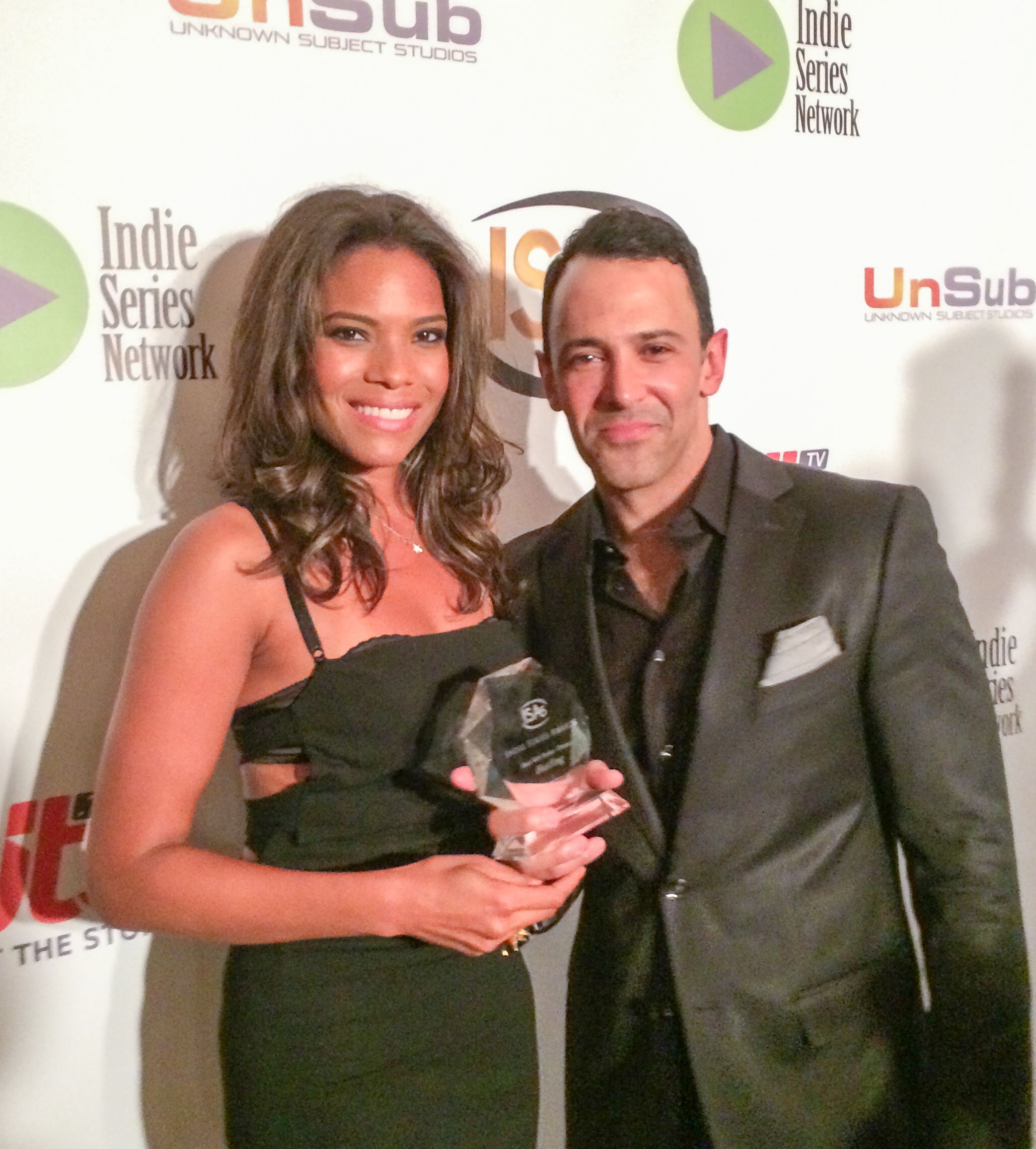 Monica Lawson celebrates Hustling Series win at the 5th Annual Indie Series Awards for Best Dramatic Series with creator Sebastian LaCause