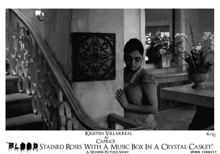 Kristen Villarreal as Caprice in Blood Stained Roses with a Music Box in a Crystal Casket