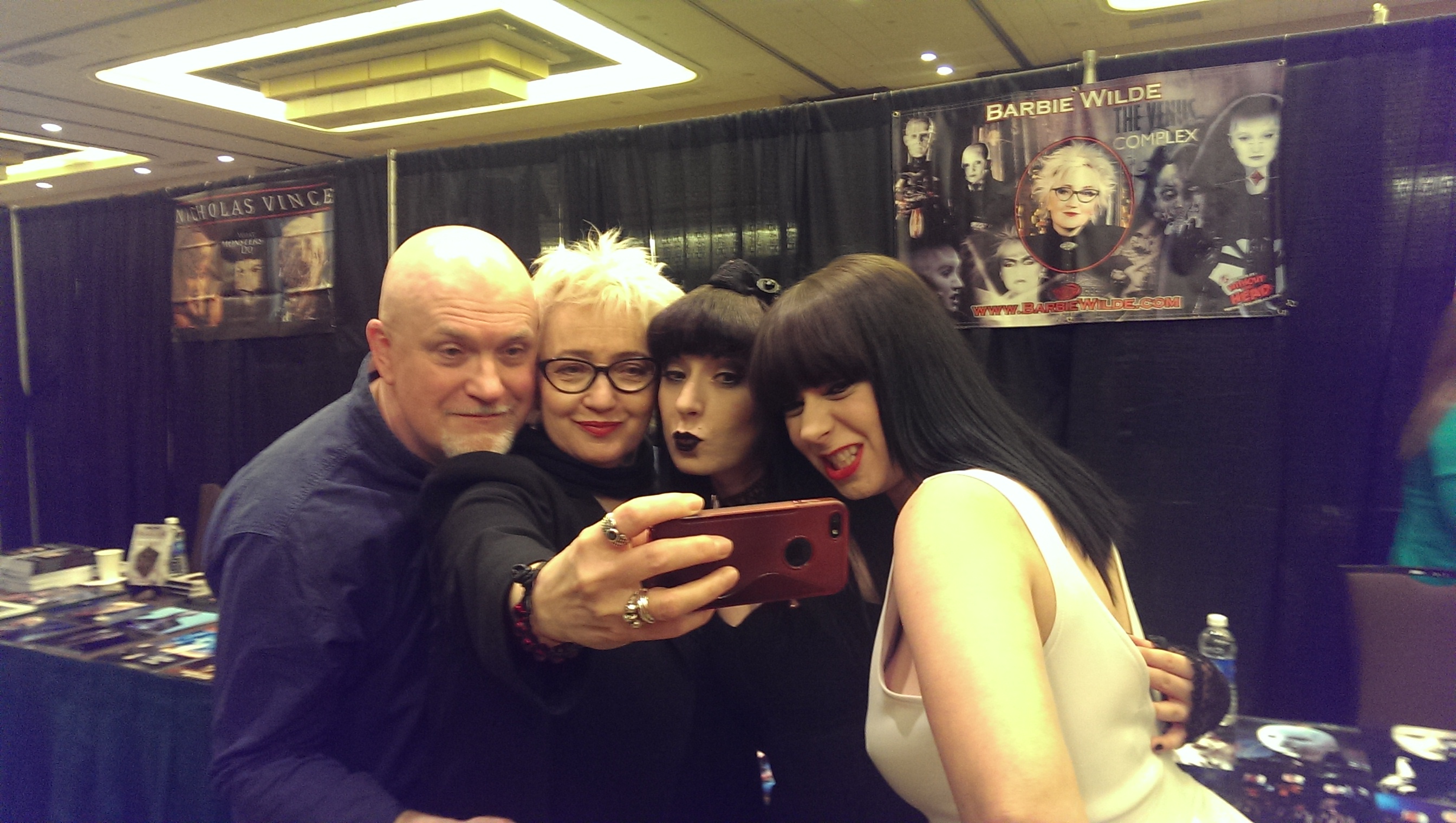 Sylvia (far right) and her twin sister, Jen (middle right), with Barbie Wilde (middle left), and Nicholas Vince (far left) at Texas Frightmare Weekend.