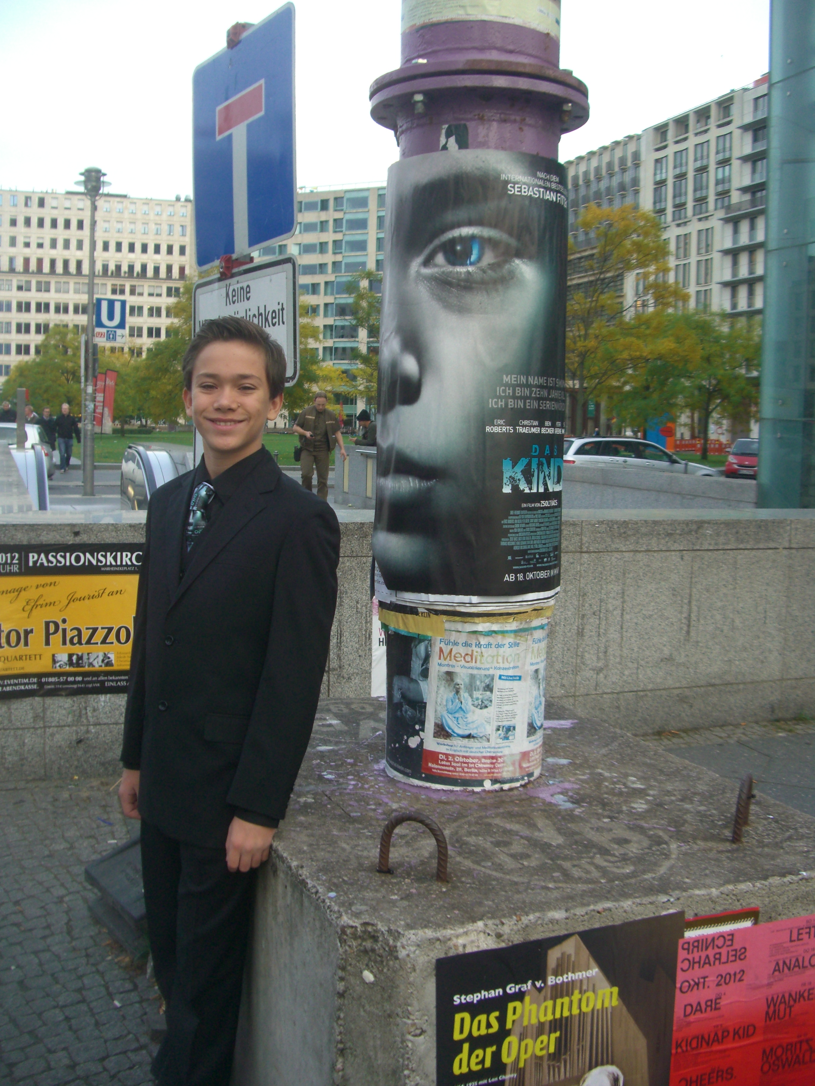 Christian Traeumer on the streets of berlin germany with his movie poster