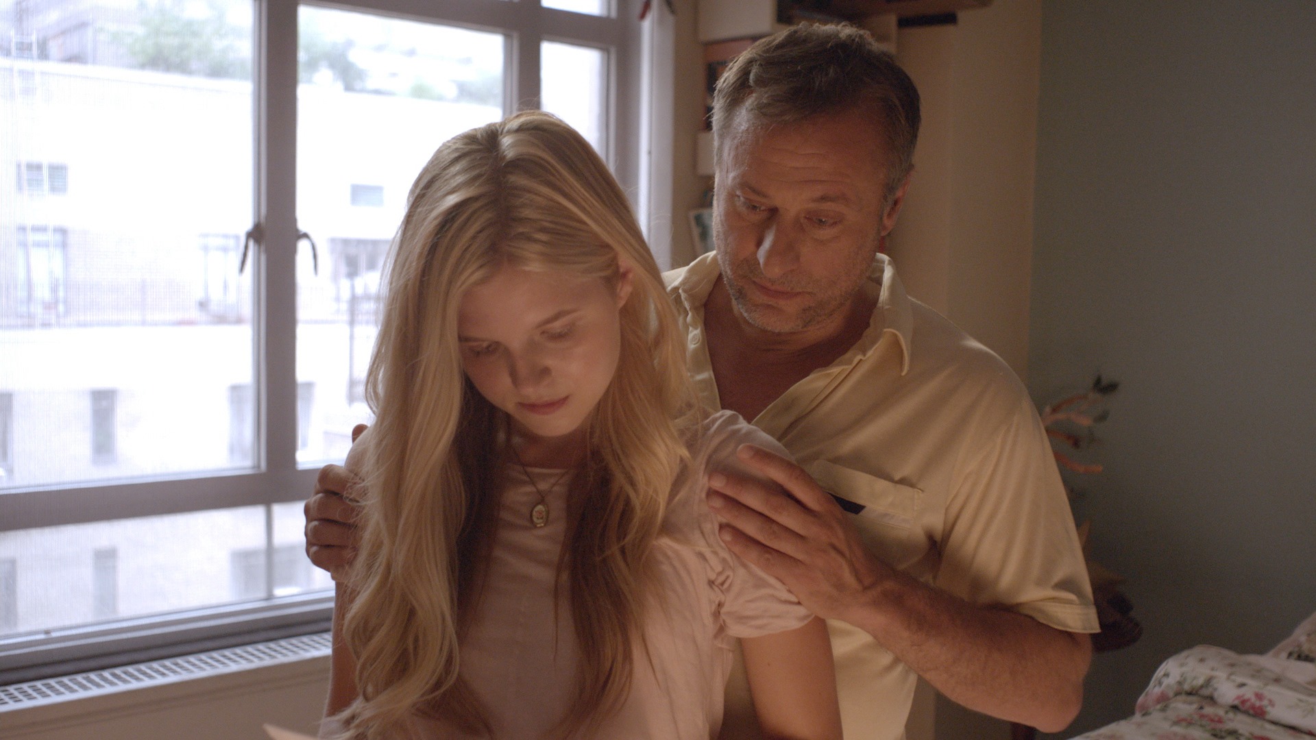 Still from The Girl in the Book (2015) with Ana Mulvoy-Ten and Michael Nyqvist