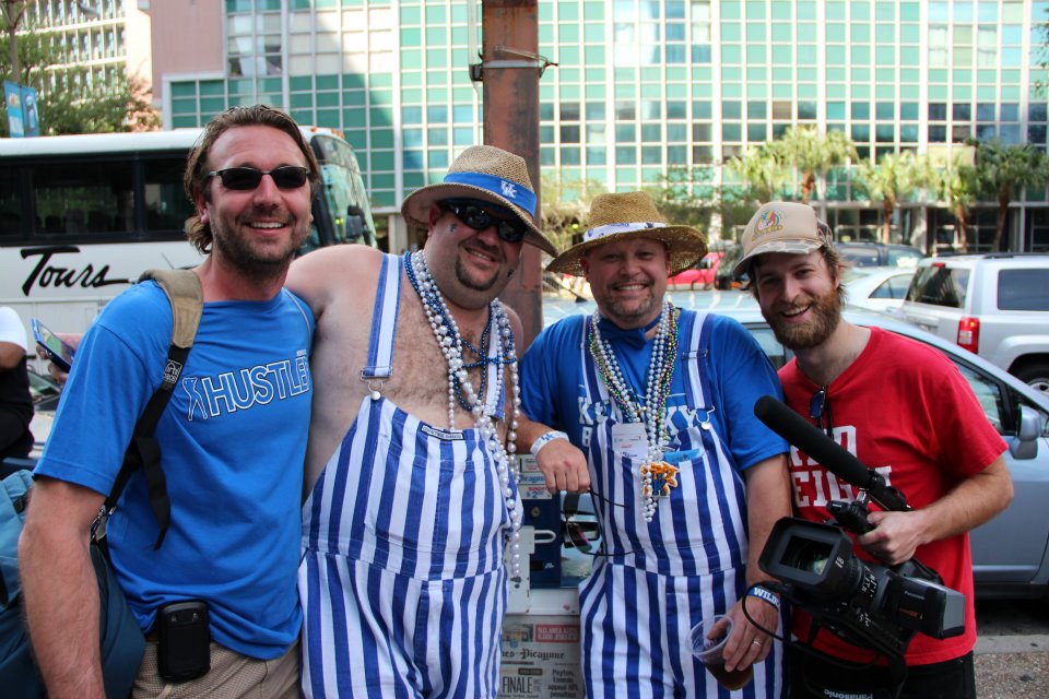 Producer Wade Smith & Director Rory Delaney pose with a couple of UK fans during a shoot for the film Red v Blue at the Final Four in New Orleans, La