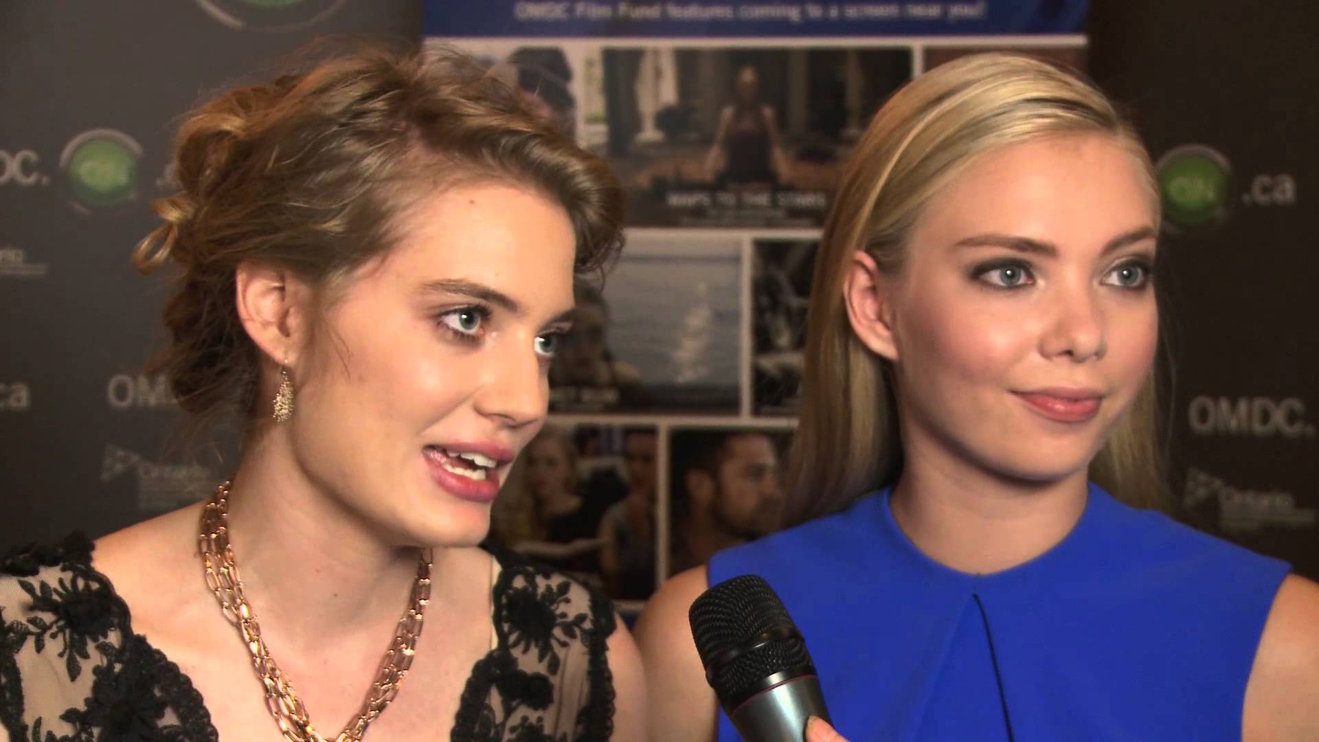 Clara Pasieka & Emilia McCarthy are interviewed on the red carpet at the OMDC gala at TIFF 2014