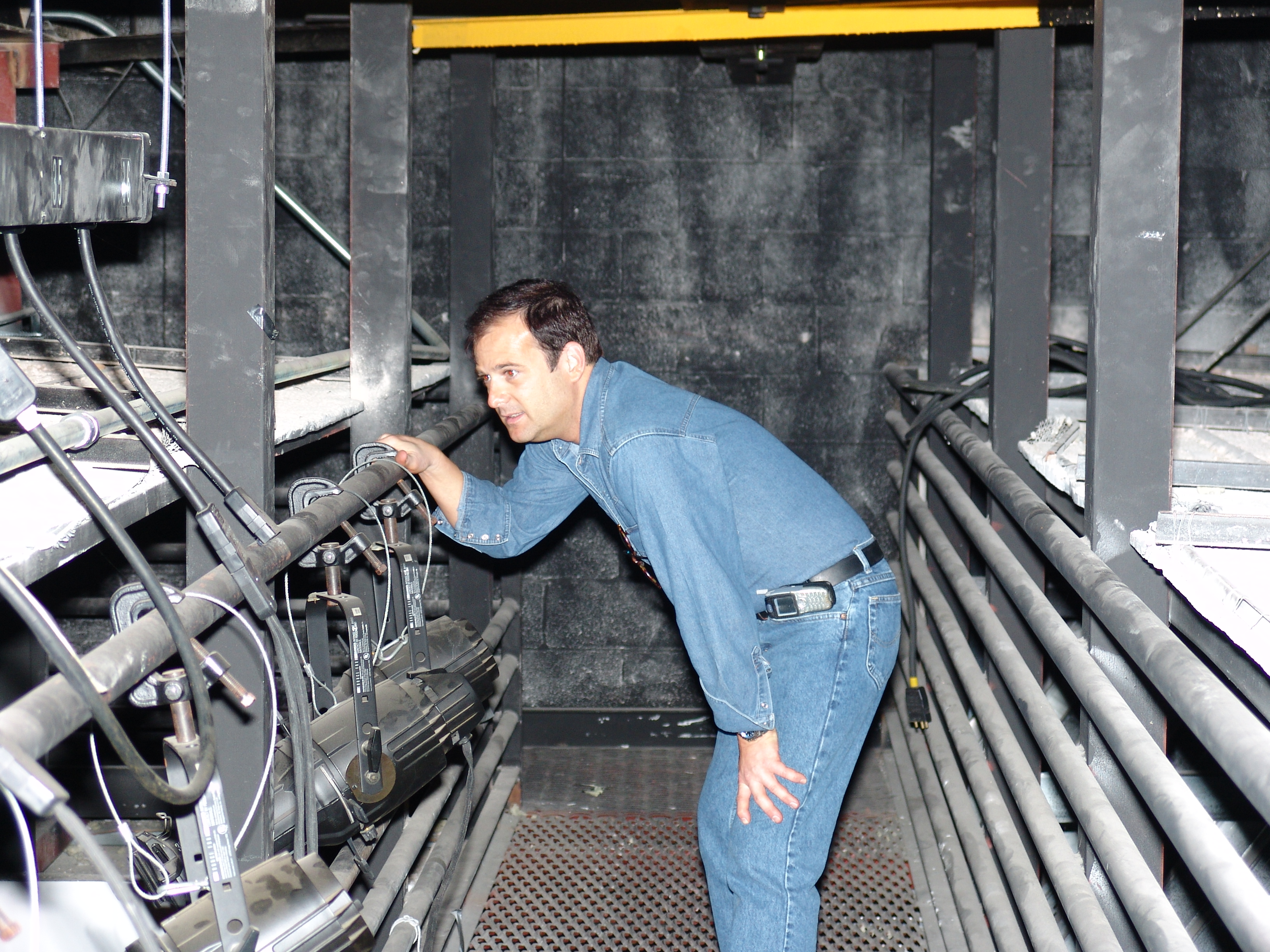 Doug La Rue inspects stage lighting equipment - 2005