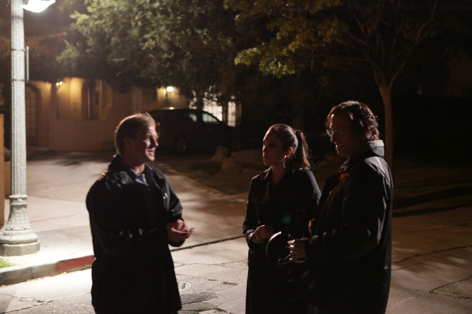 Actors Kenny Johnson and Erin Daniels with Director George Pappy on the set of 