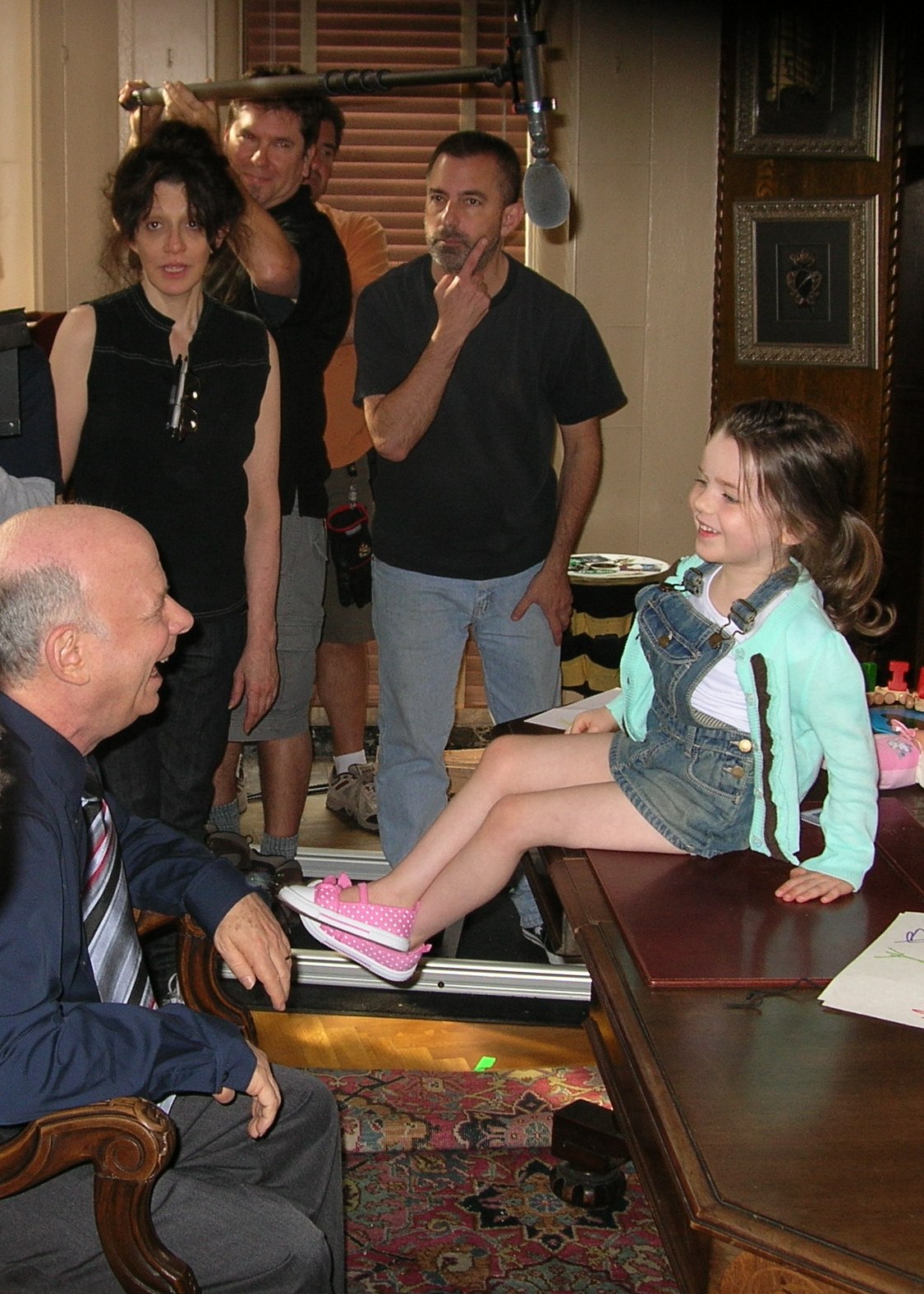 olivia & wallace shawn between takes on set of 
