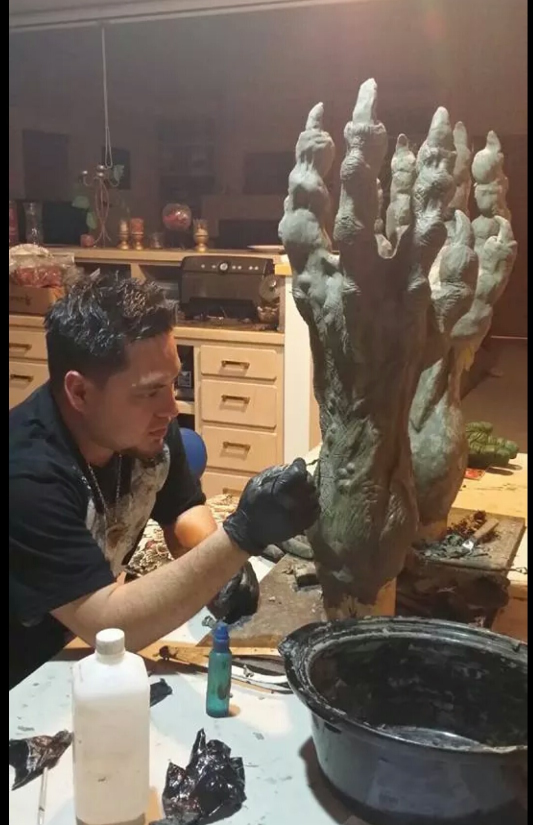 Daniel (DC) Casillas sculpting 3 foot creature arms