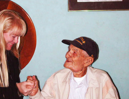 Hilary congratulating Gregorio Fuentes on his IGFA Captain's Hall of Fame Award