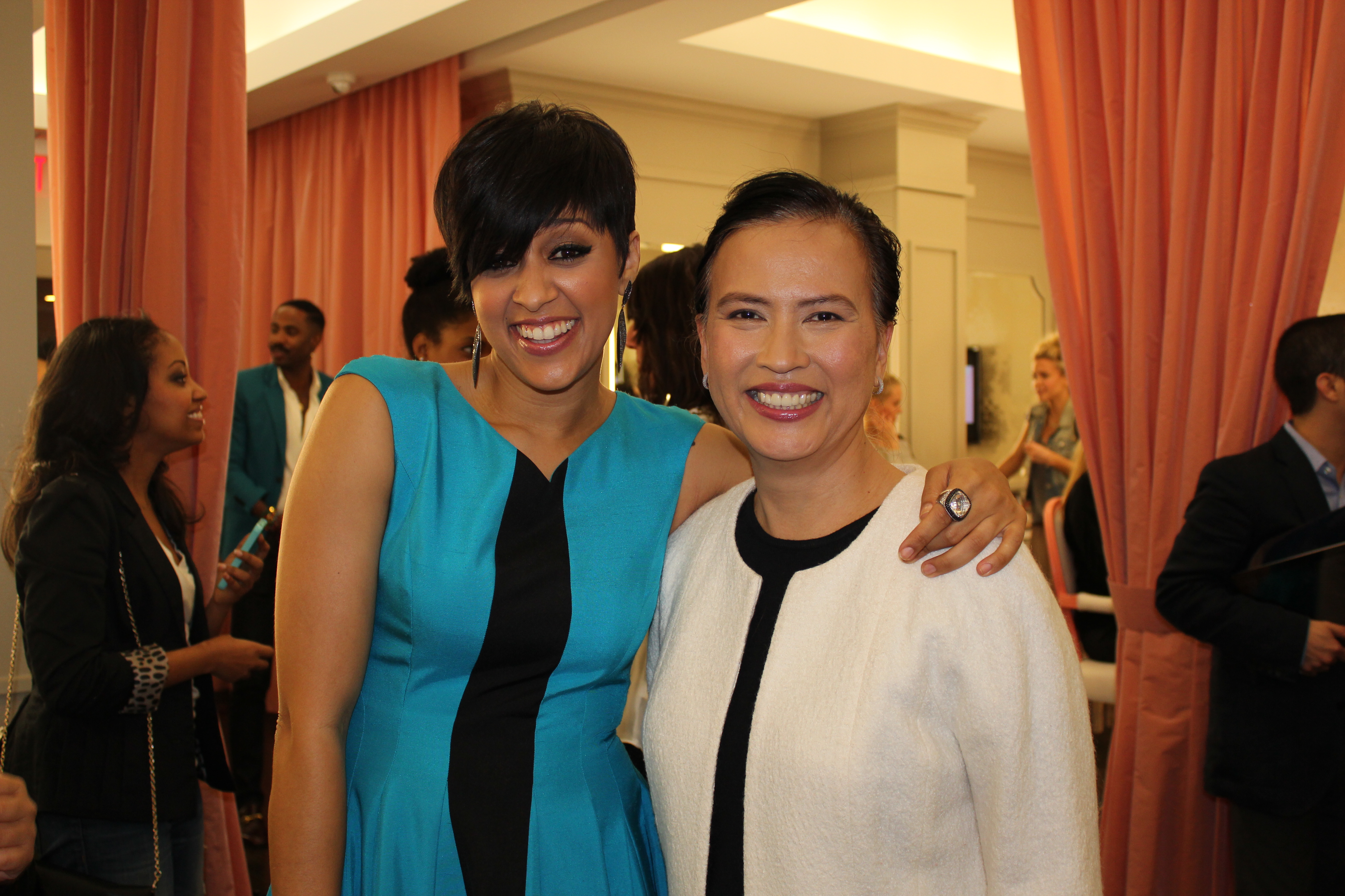 Lucille Atillo with Tia Mowry at Dress for Success- Puffs tissues in Blushington Make Up in West Hollywood, California.