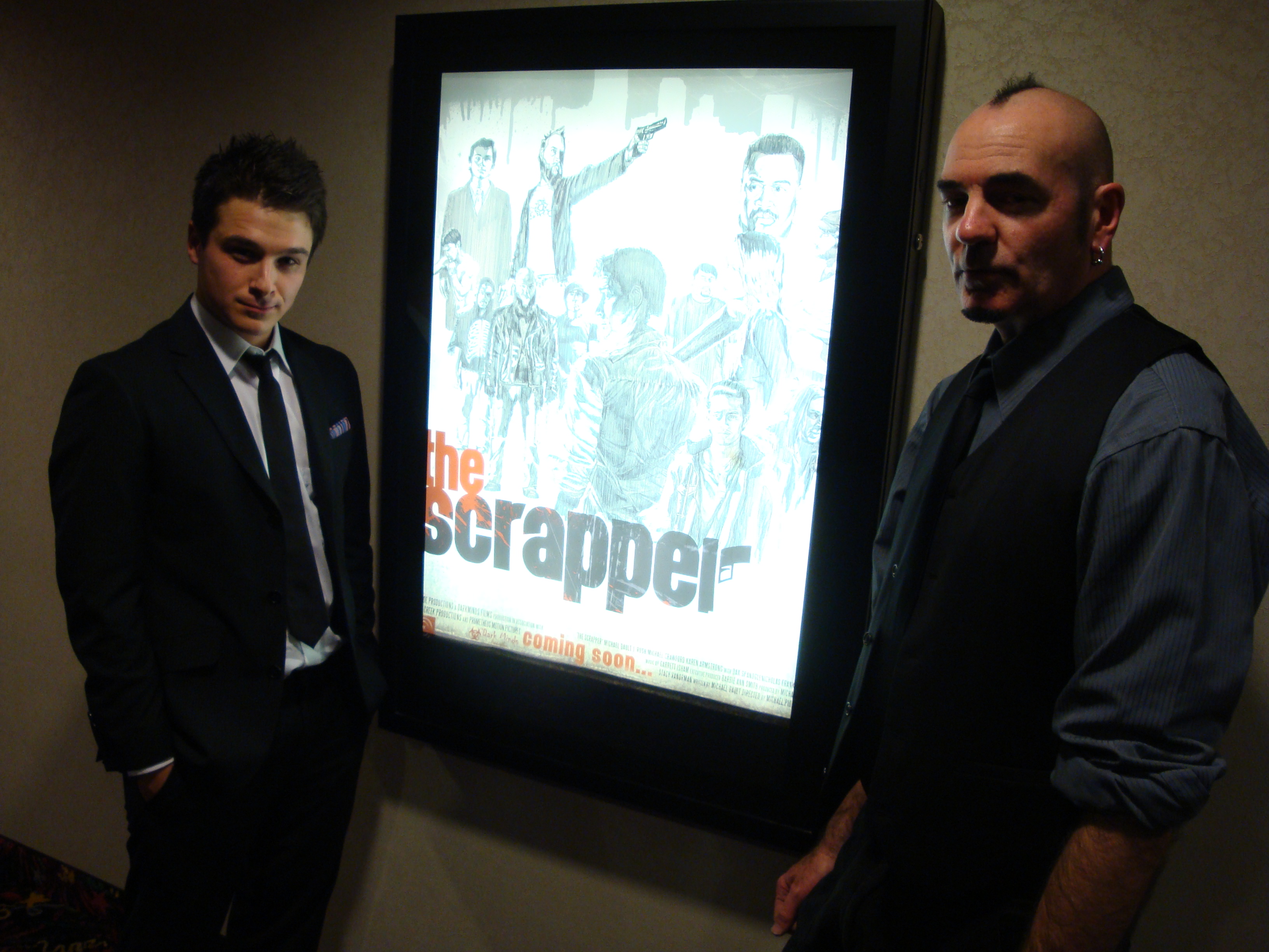 Red carpet permere of THE SCRAPPER. Actor Craig Bouwens standing for photo shoot with co-actor Michael Dault
