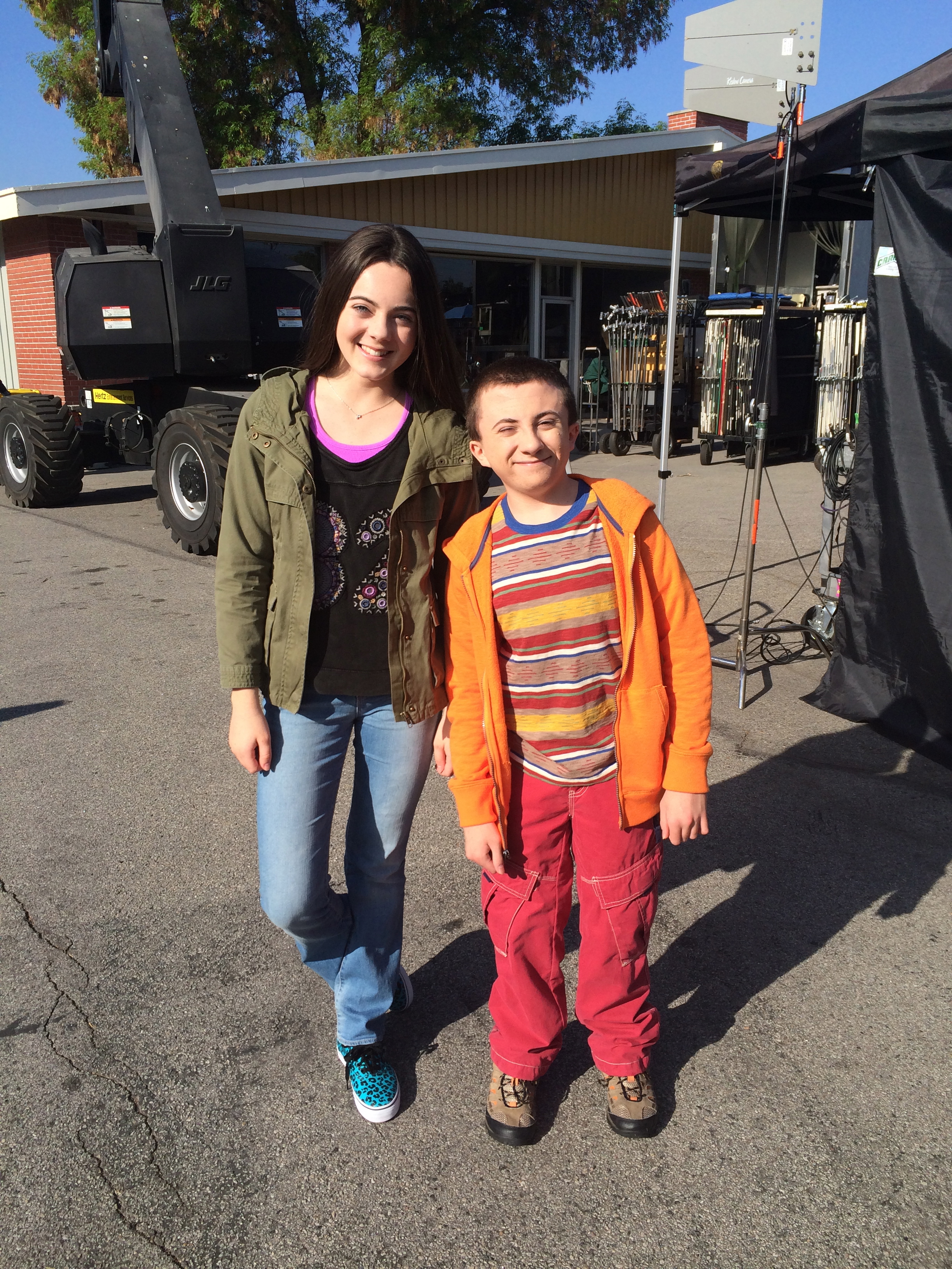 Ava Allan and Atticus Shaffer on the set of 