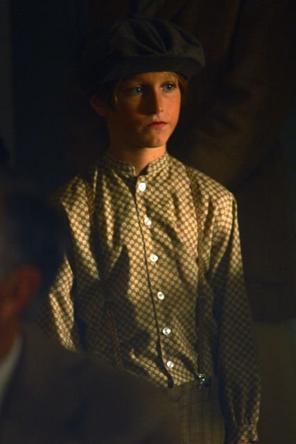 A young boy (Sam Slocum) at the Scopes Monkey Trial.