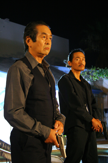 Actors Toshi Toda and Koji Wada behind the scene on the movie Delivered. Directed by Michael Madison and Linda Nelson.