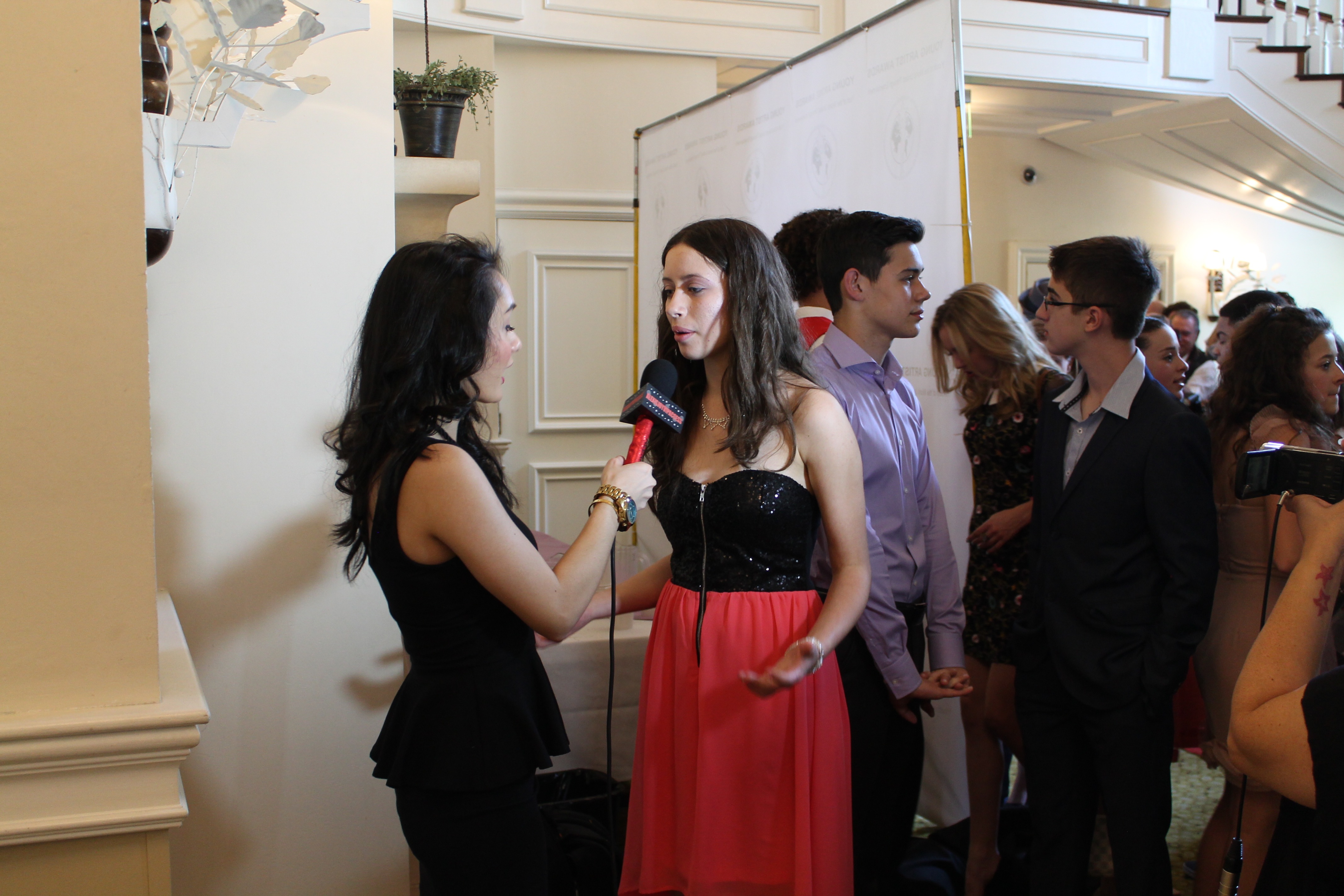Janette Bundic being interviewed by Alexis Joy VIP Access at the 2015 Young Artist Awards in LA