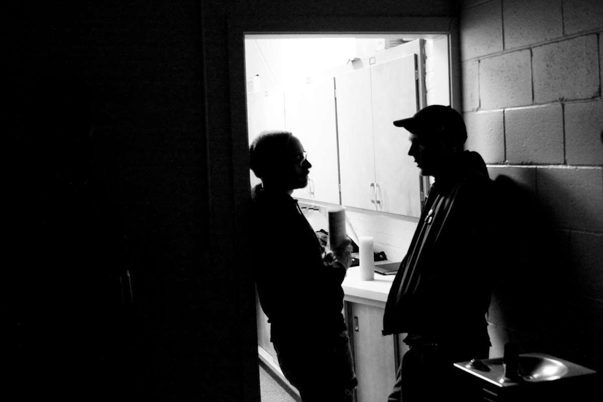 Directors Adam Bartlett and John Pata discuss a scene on the set of Dead Weight.