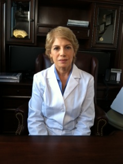 Susan playing a doctor in an NIH training video about genetic testing.