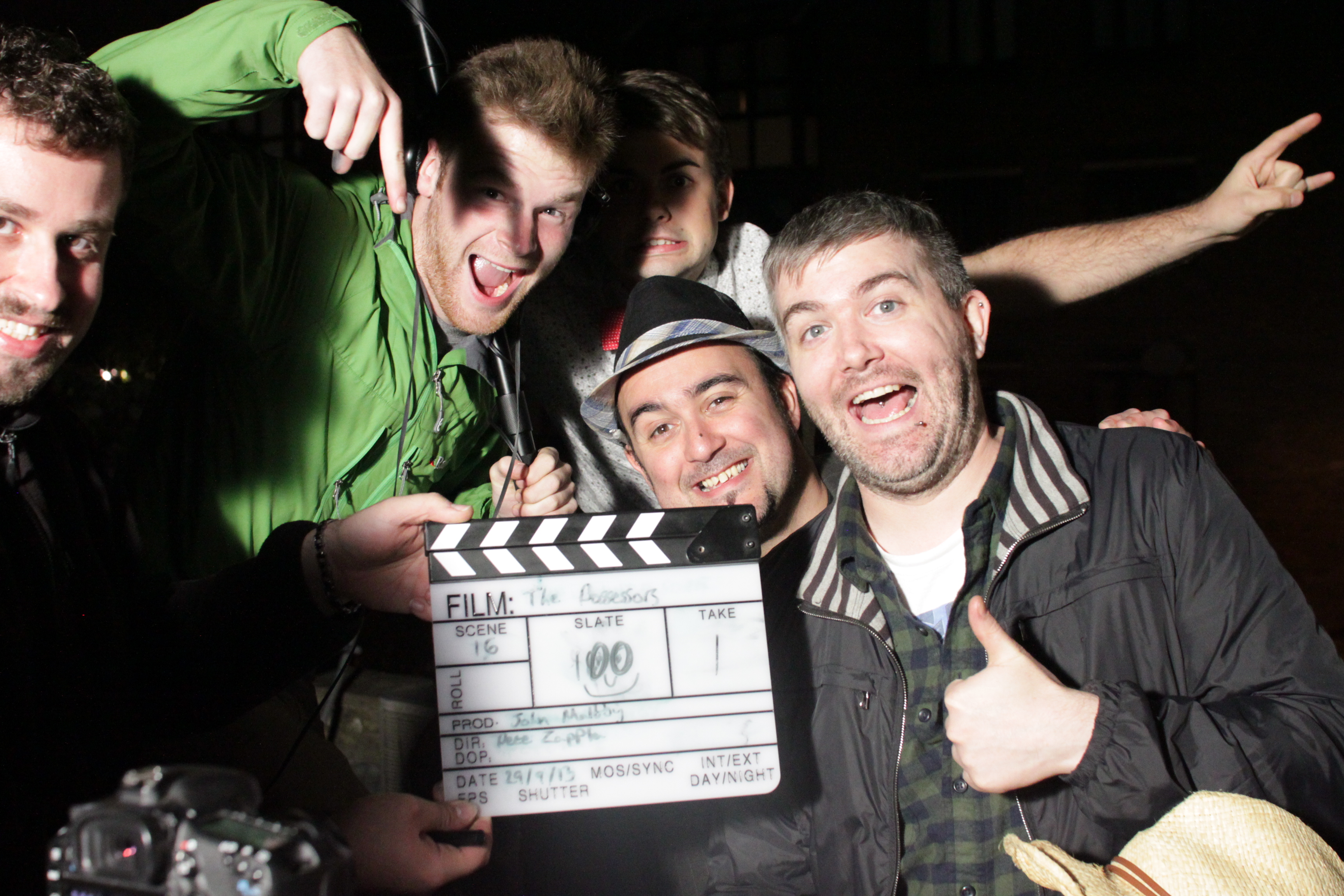 Cast and crew celebrate reaching slate 100 on day 4 of 'The Possessors' shoot