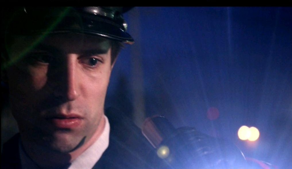 Michael Kram portraying an Italian police officer in the 