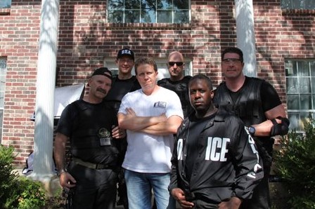 As stunt coordinator posing with cast on set.