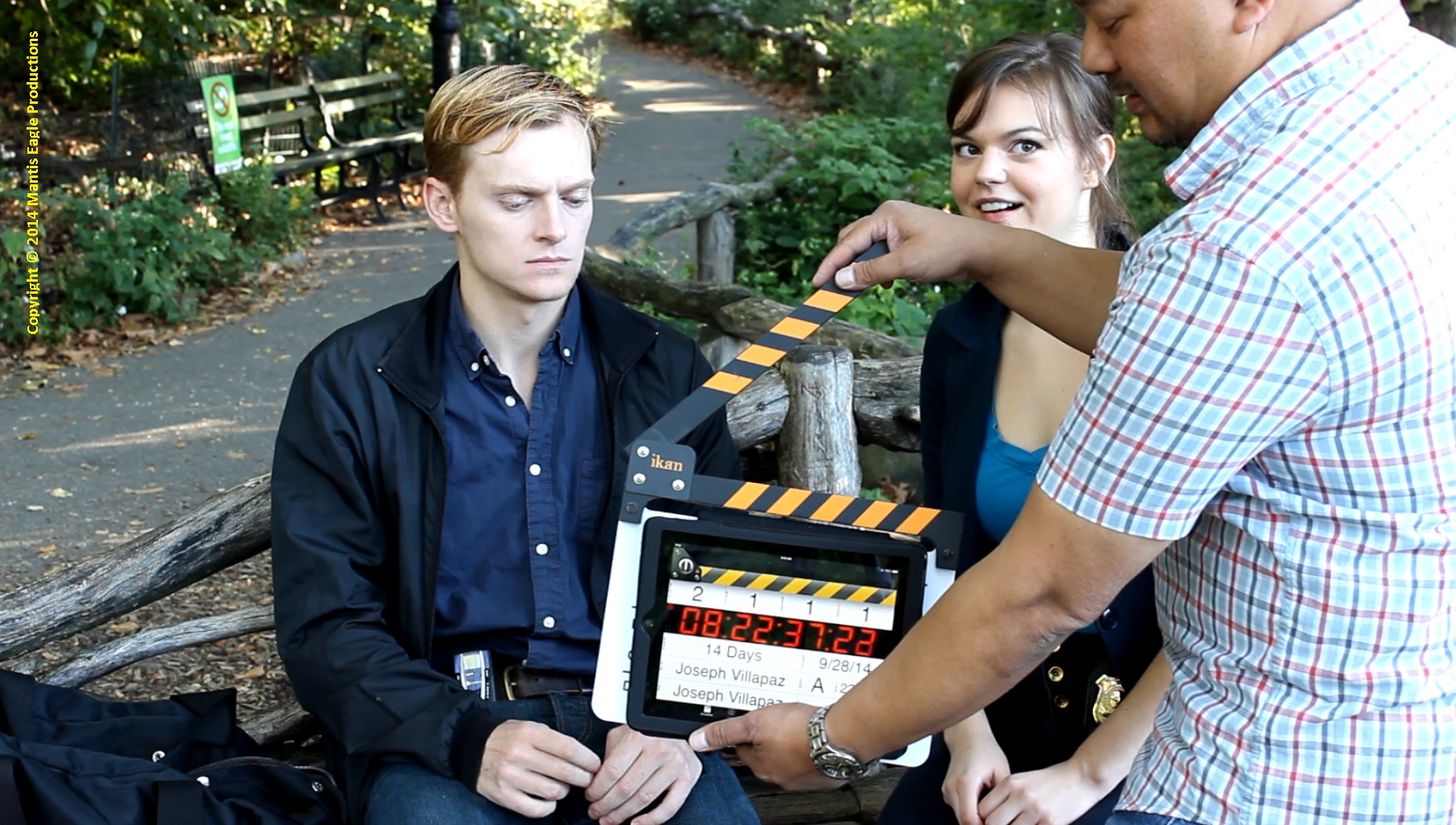 Michael Wetherbee and Emily Dennis ready to shoot their scene and director Joseph Villapaz works the slate.