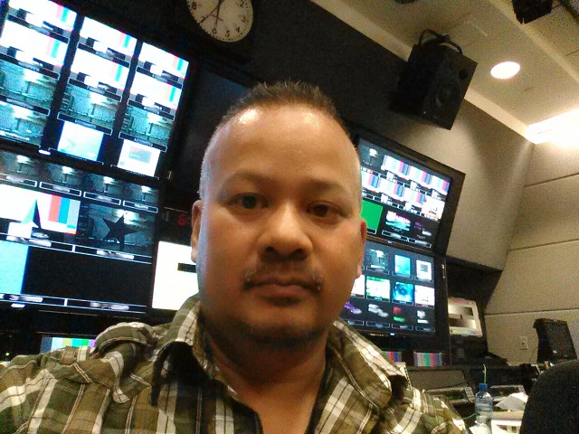 Joseph Villapaz in the TV control room.