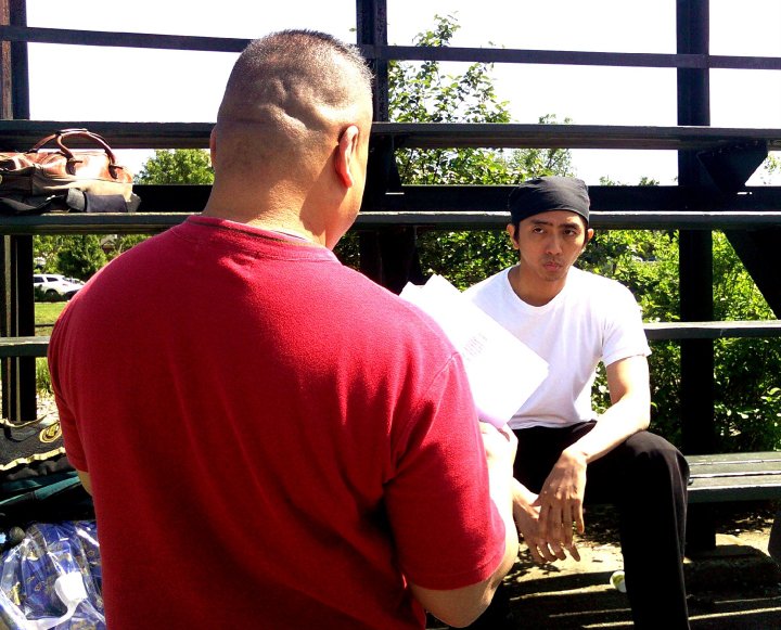 Joseph Villapaz rehearsing a scene with actor Vincent Veloso.