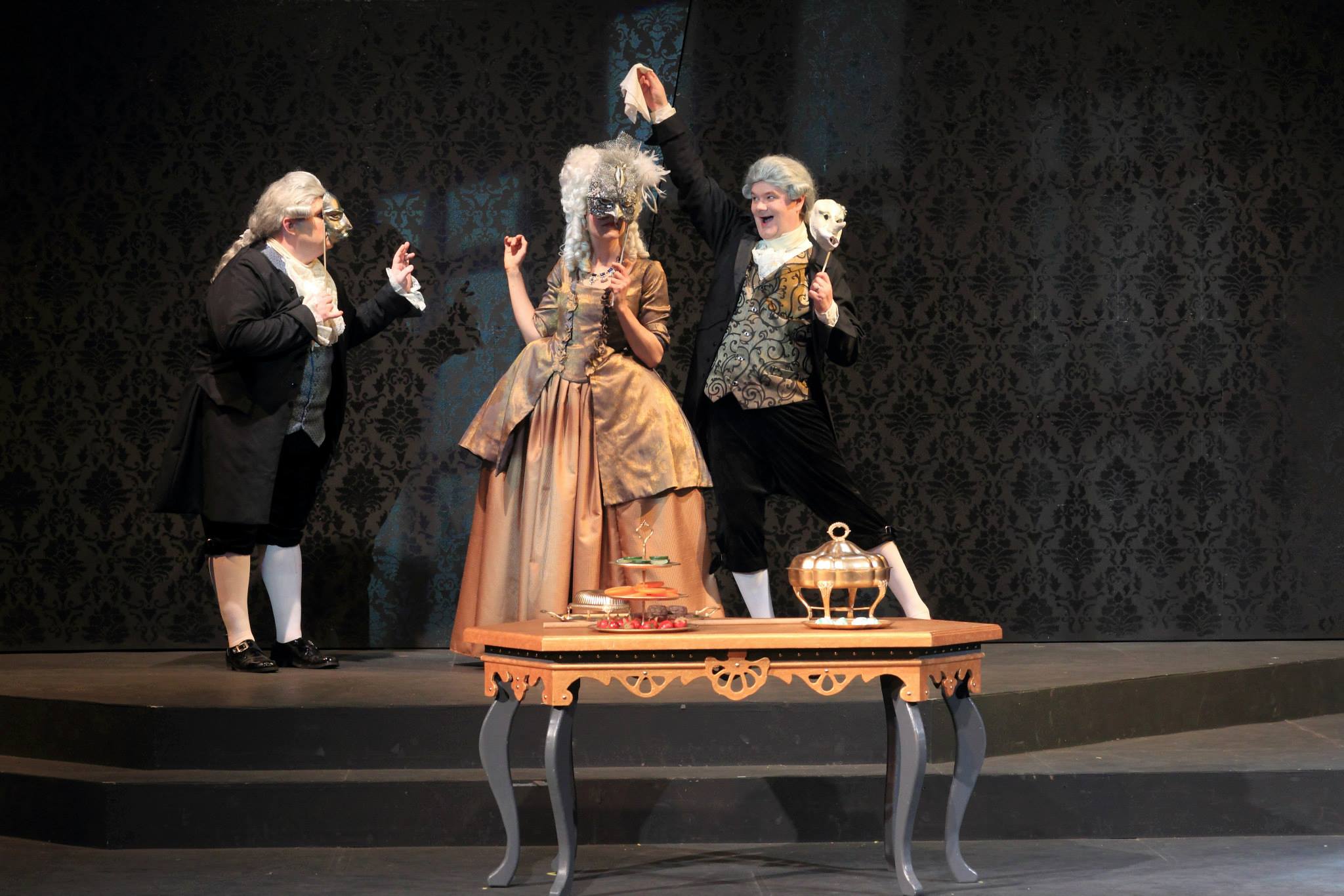 The Venticelli and Constanze play a game of forfeits. North Carolina Stage Company & ACT Co-Production of 'Amadeus'.