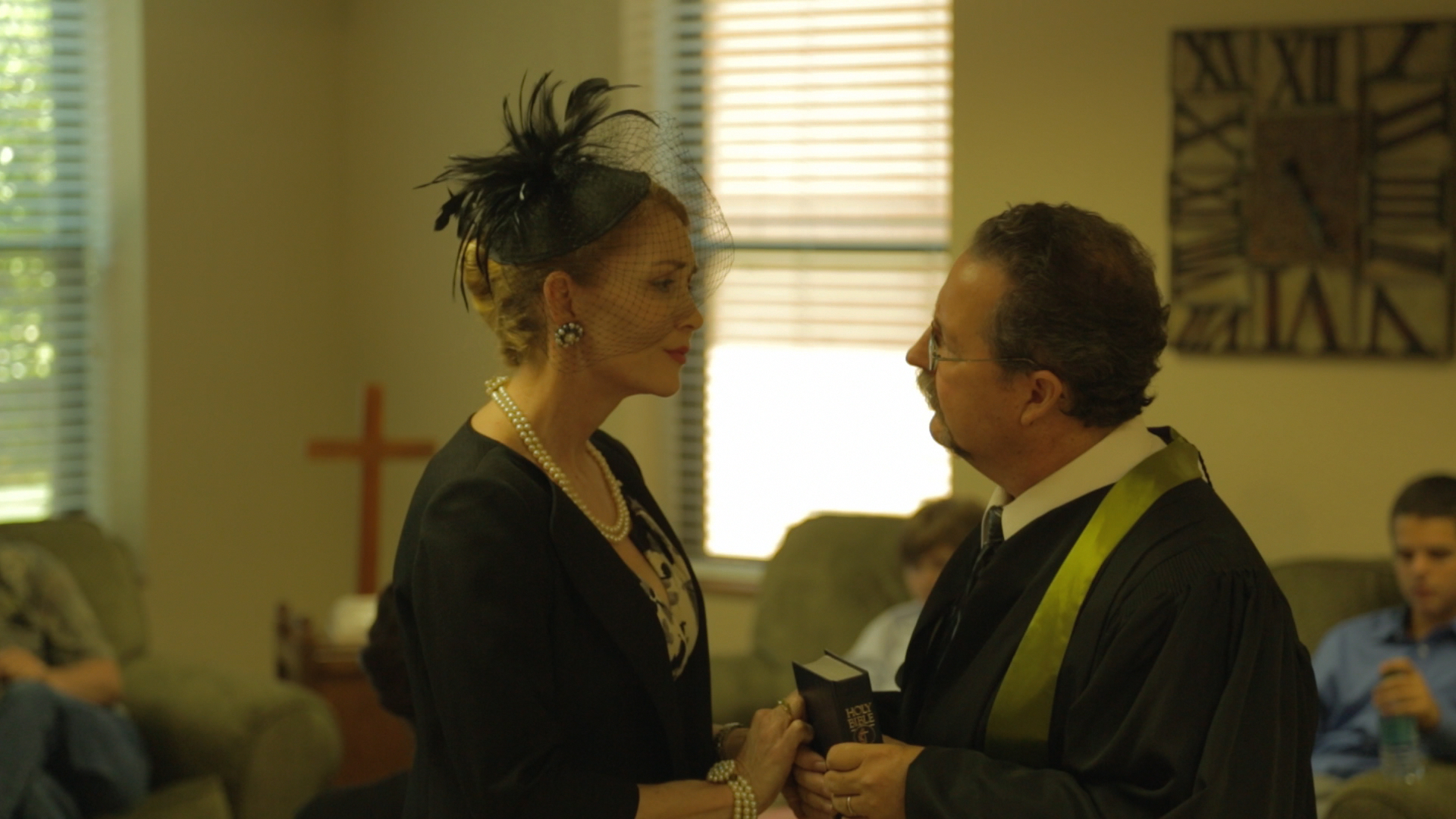 THE LONG DRIVE HOME. Susan Tate (Laurie Cummings) confers with the preacher (Herman Lee Brown). Written and directed by William Tyler. (2013)