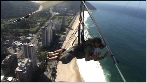 Reporter Tayfun King, Hang gliding, Rio de Janeiro, Brazil, BBC World News television travel show 