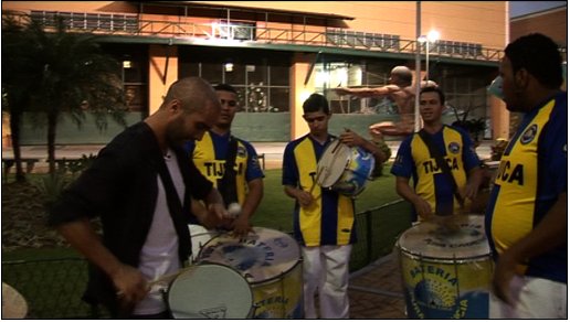 Reporter Tayfun King, Playing the Samba Drums, Rio de Janeiro, Brazil, BBC World News television travel show 