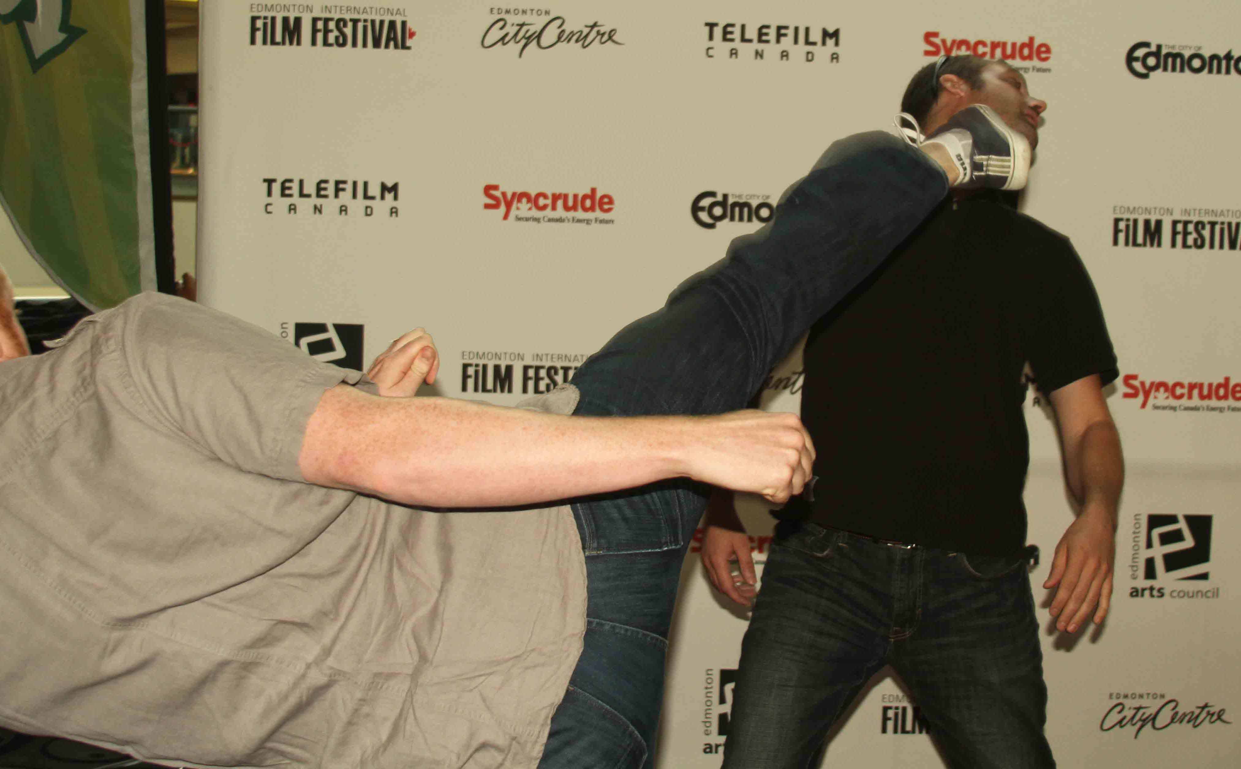 Jeff Burke's iron chin is breaking the foot of Ryan Burke at the Edmonton International Film Festival.