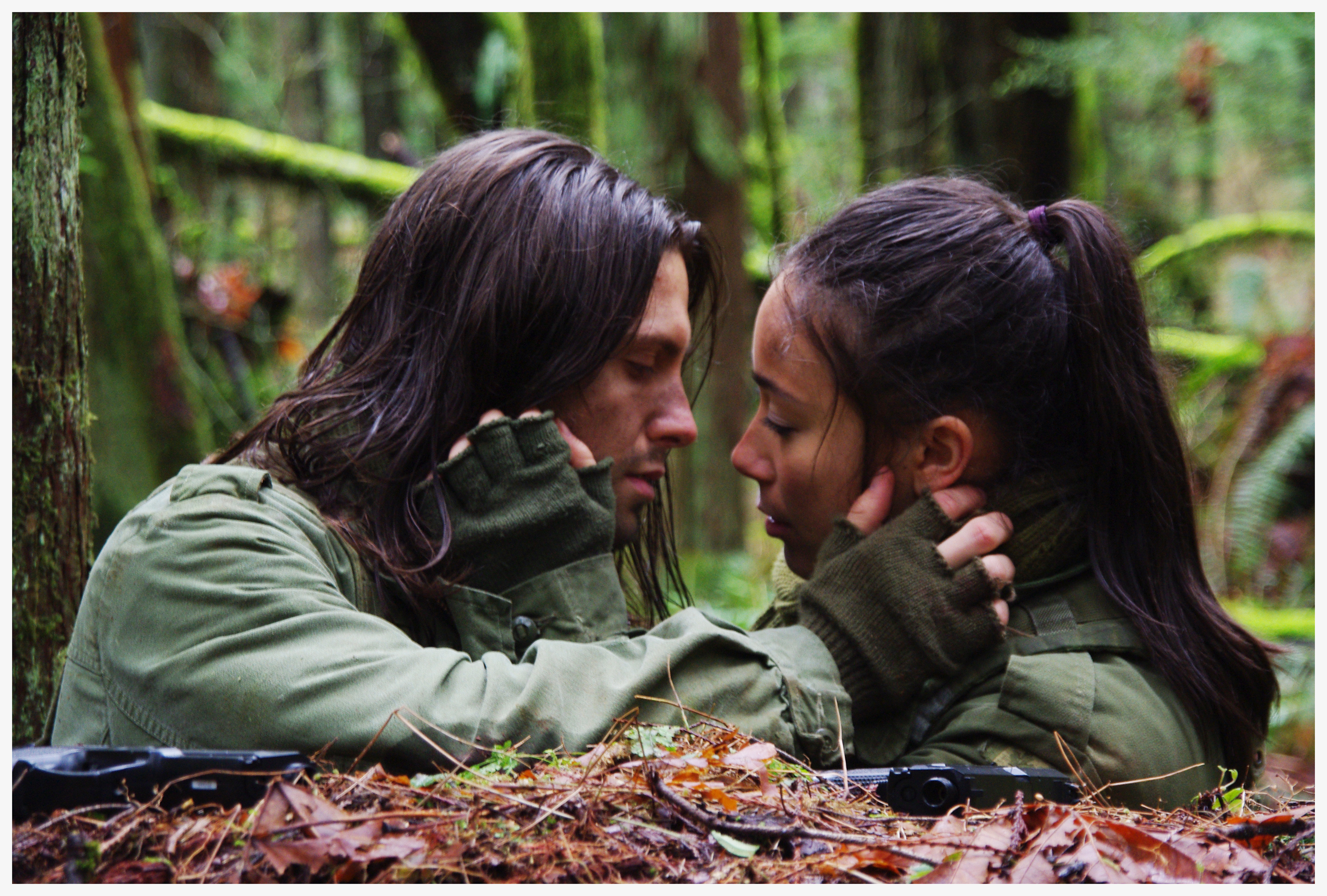 Kasper and Fara share a tender moment amid being pursued in the opening of Lyrics To Dying Rebirth.