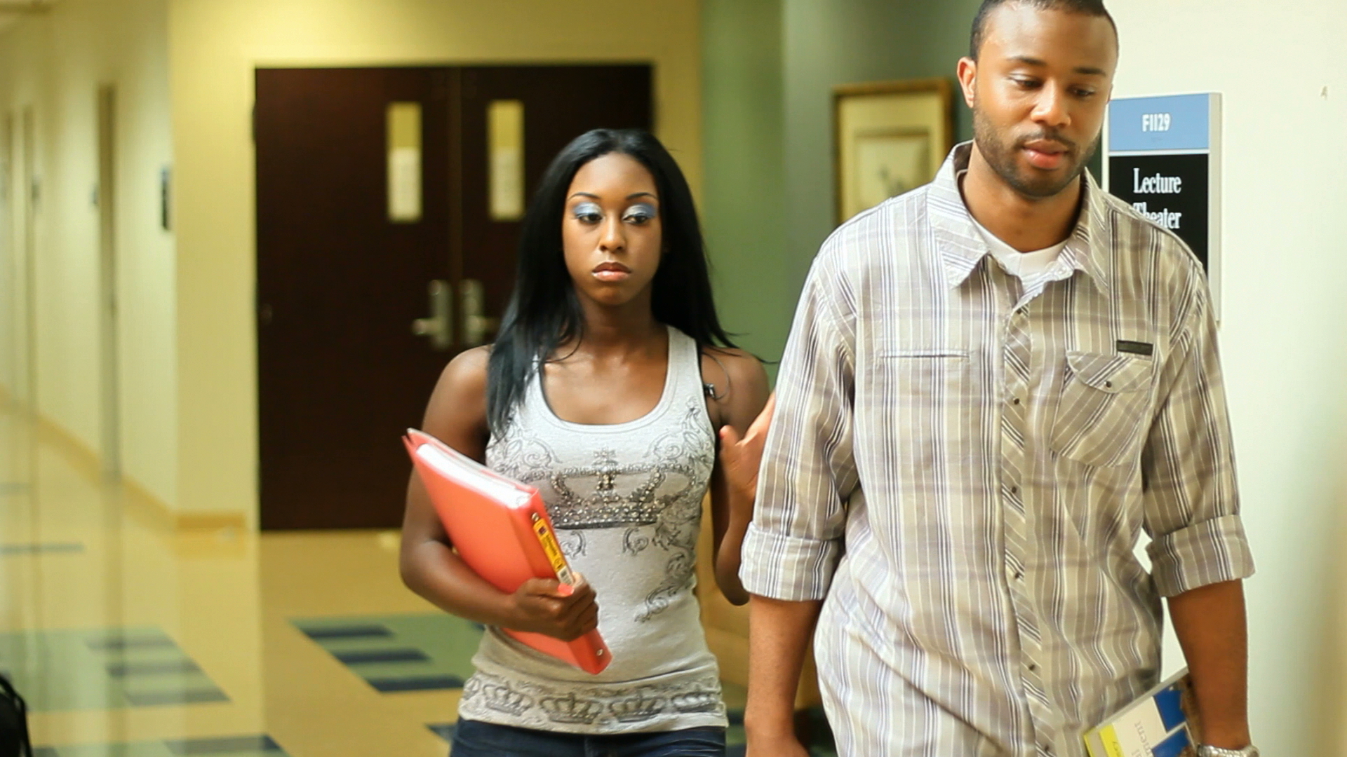 Jenesis (Rachelle Neal) walks in anger as Cassious causes them to get dismissed from class.