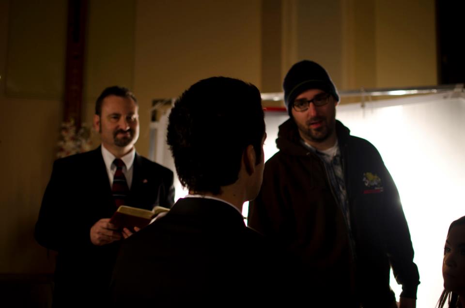 Director Clark Birchmeier working with actors Mark Benjamin and Ray Silveyra in-between takes.