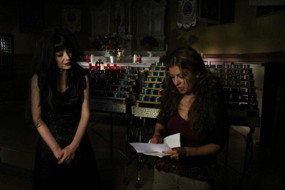 Kelly getting direction from Director Patricia Chica for the church scene from the Tangled Forest video
