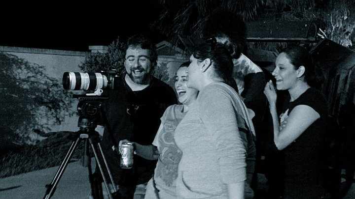 Cast and crew checking the scene just shot. Jason Johnston, Cristina Trevino,on the right is Araceli Cazares.