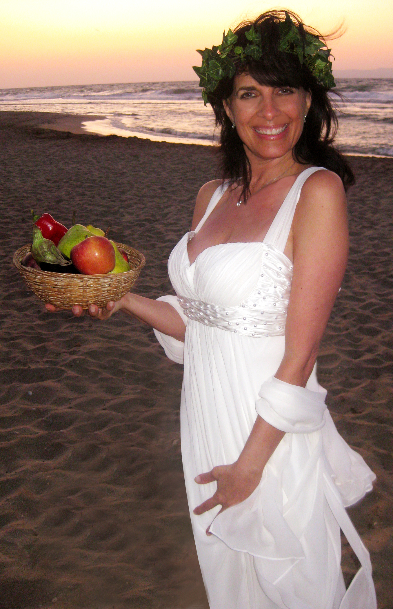 Cynthia Daddona as the goddess of love, wisdom and food on the beach in Greece.