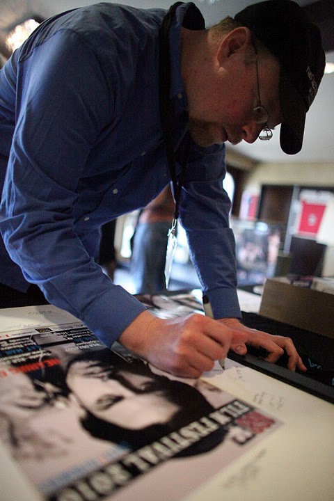 Producer/Director/Actor Christopher Shawn Shaw signs the Producer's poster at the 168 International Film Festival, 2010 www.SkipListeningShort.com