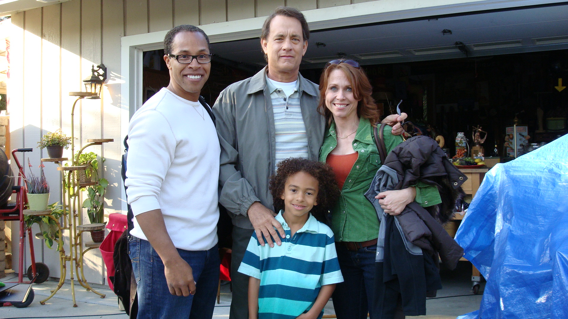 On the set of LARRY CROWNE with his mom (Melissa Barker), his dad (Erik Betts) and writer, director, producer and starring two-time Academy Award winner Tom Hanks.