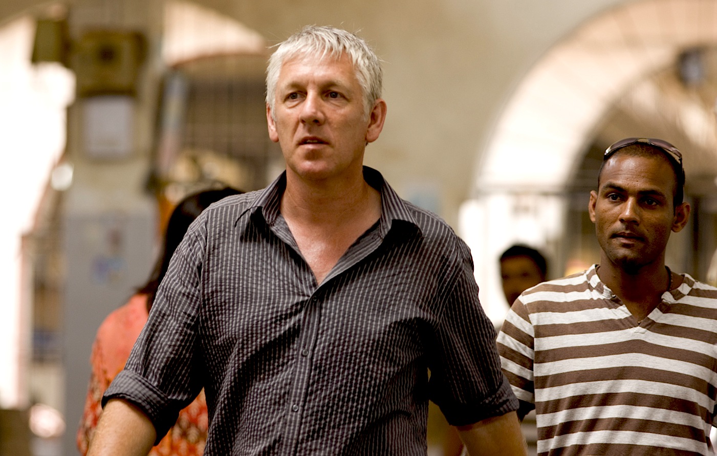 John Owen, director, Sachin Desai, location consultant, on set for The Goa Run, in Panjim fish market Goa, India.