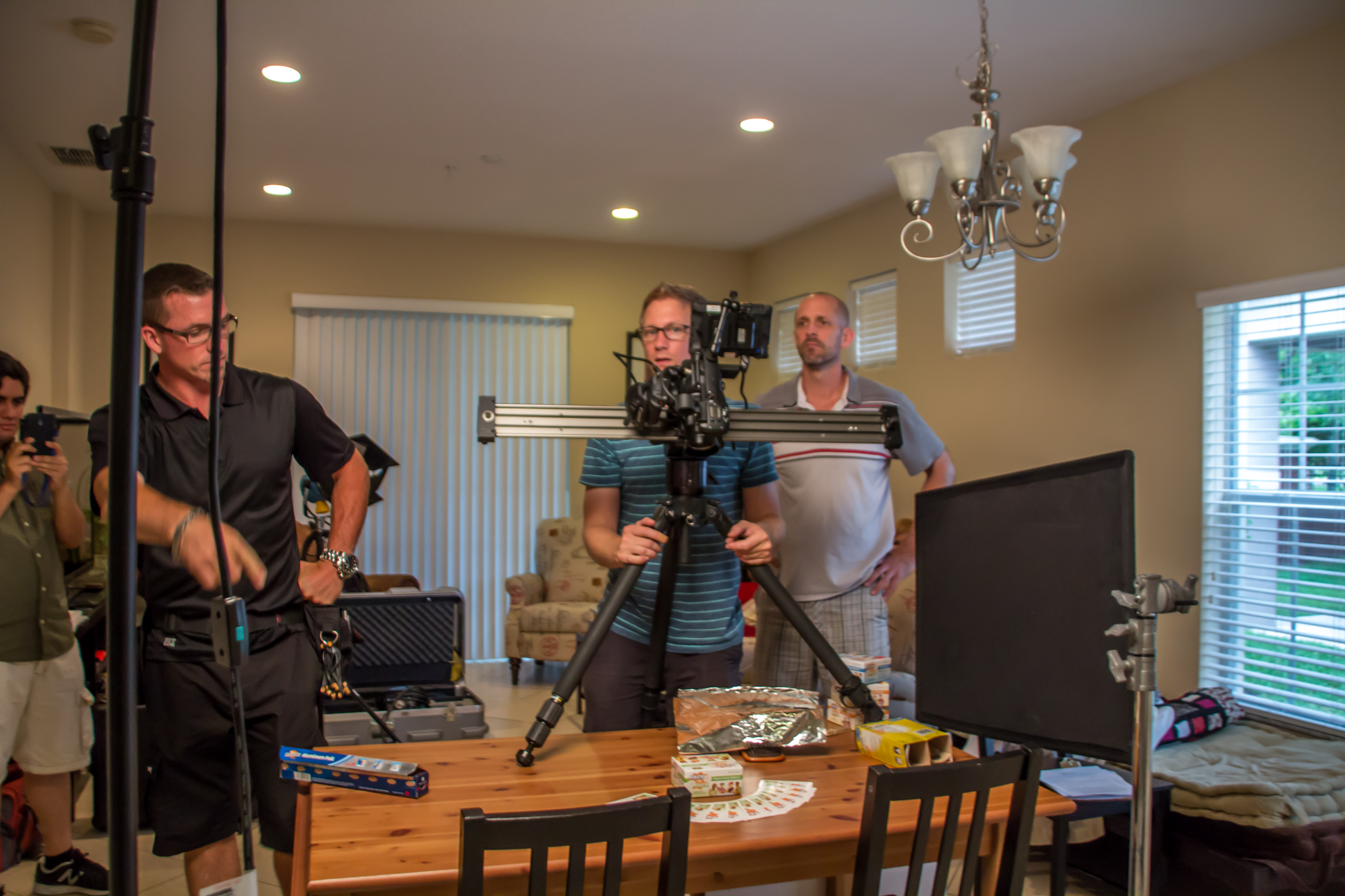 Director Trevor F. Ward behind the scenes of a commercial shoot with DP Ryan P. Dean and 1st AC Franklin Whitlatch.