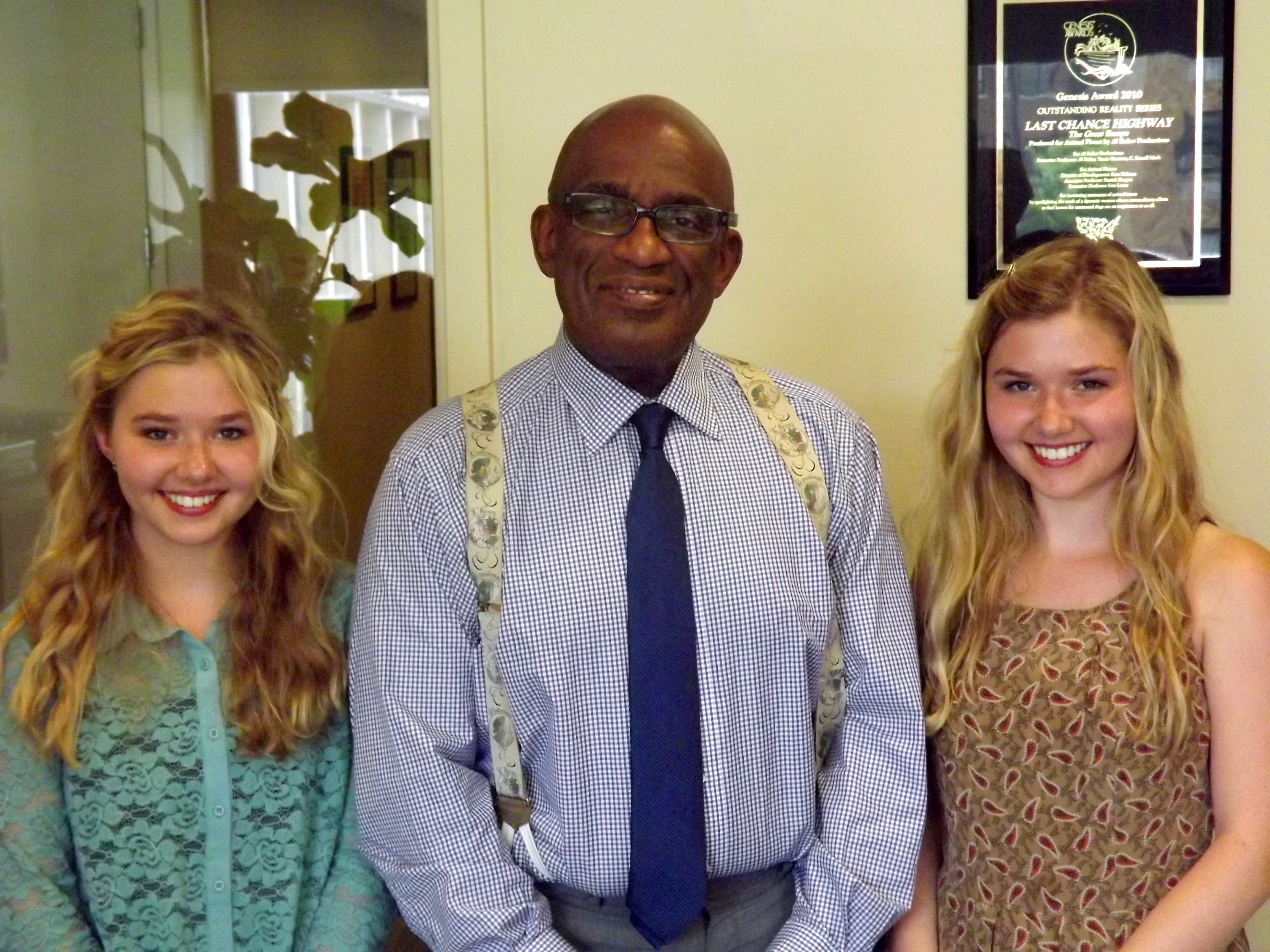 Cailin Loesch (left) and sister Hannah Loesch interviewing Al Roker in 2013.