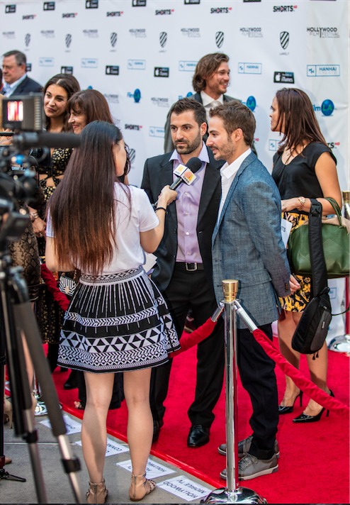 Directors Jordan Horowitz and Frank Ferendo speak to press on the red carpet at the Hollywood Film Festival