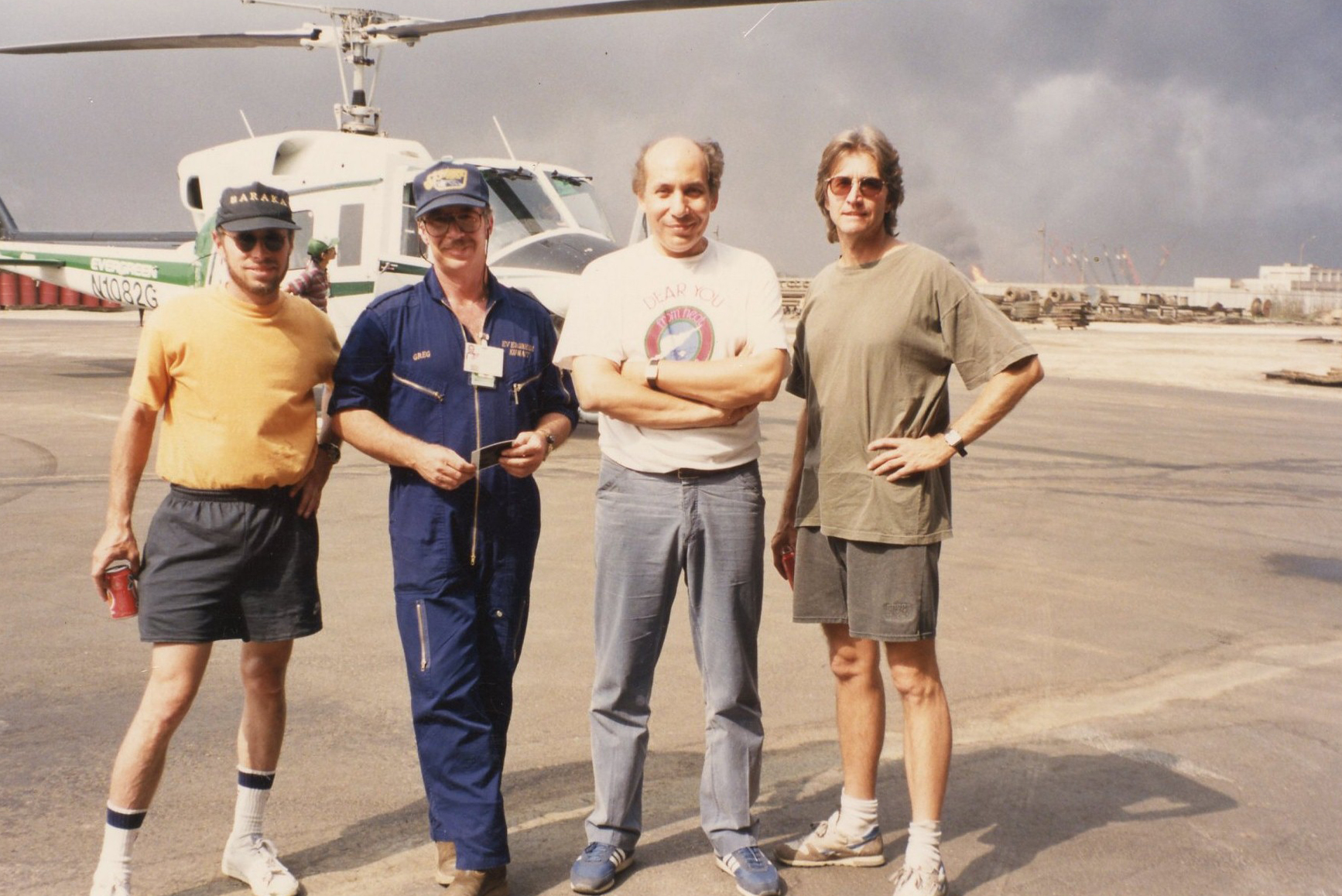 Before taking off to shoot the blazing oil wells of Kuwait's Burgan Field - Farouq surrounded by 'Baraka's DP & Director Ron Fricke, super pilot Greg Nutt and Mark Magidson in 1991