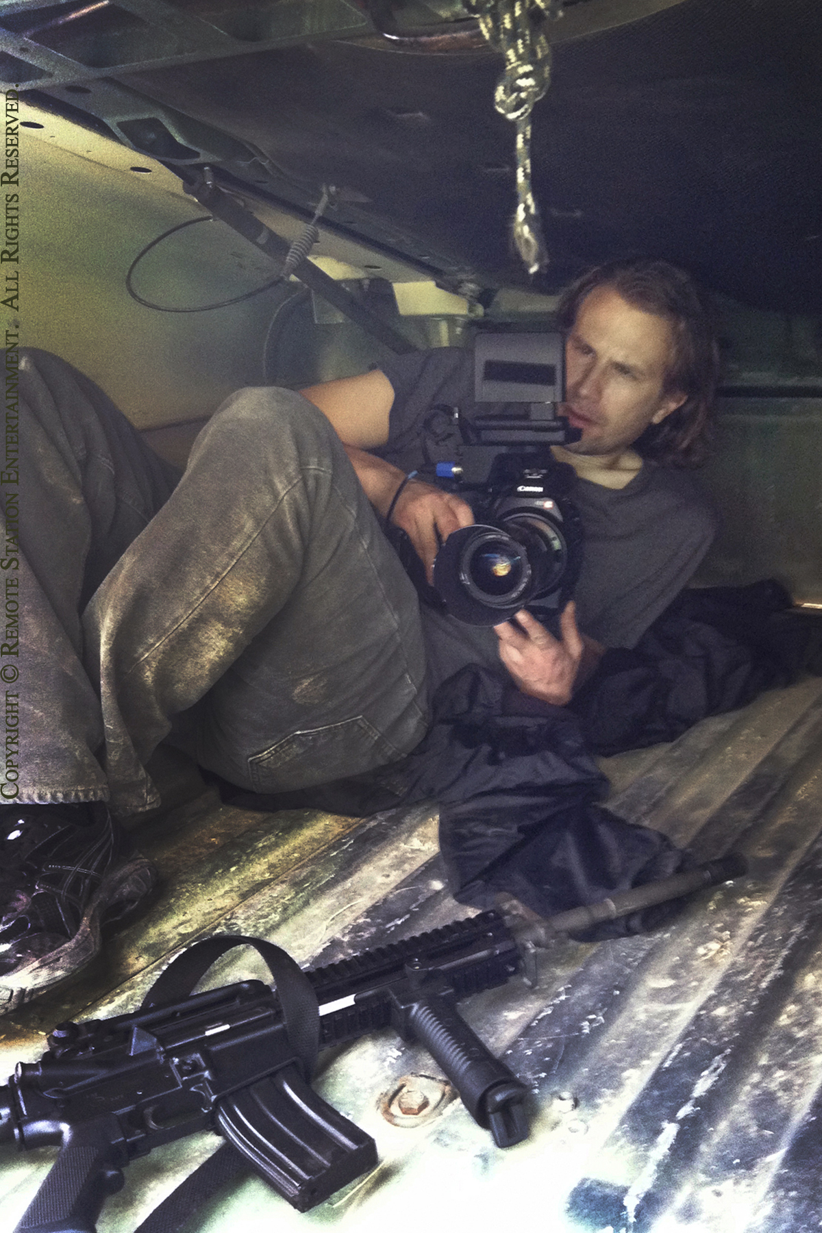 Director, producer, writer and sometimes cinematographer William Norton sets up a shot from within a militarized Humvee for his political thriller False Colors.
