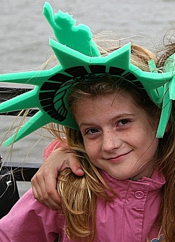 Caitlyn on set of Meet Dave. Little girl walking up the pier and standing in front row watching Dave.