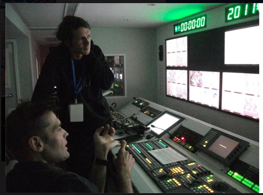 Chad - DoP and Live Cut Director - talking to video engineer in rehearsal for the Booey Lehoo Concert film in Beijing, China.