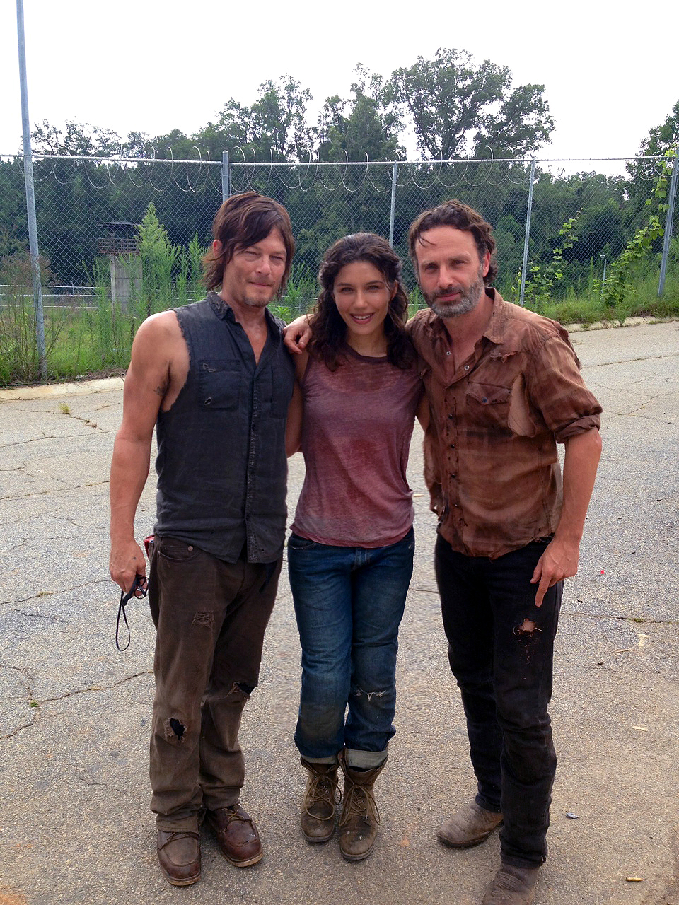 Juliana Harkavy, Norman Reedus, and Andrew Lincoln in The Walking Dead