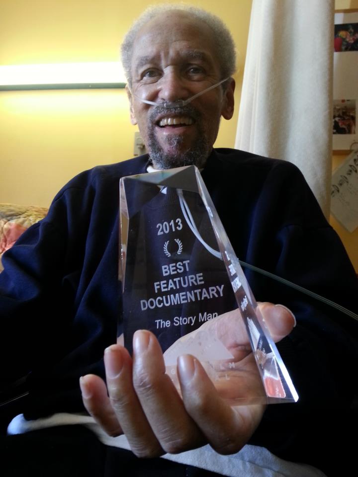 leslie - the story man, holding the award for best feature documentary